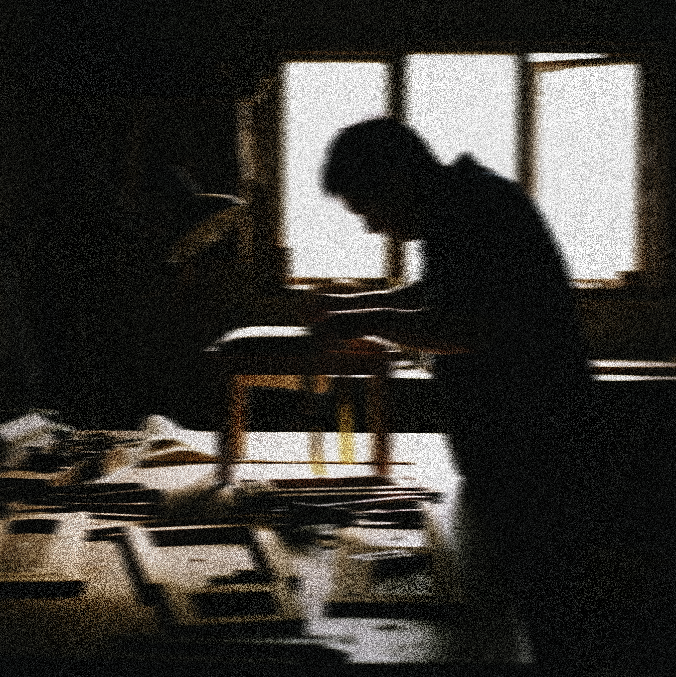Silhouette of an upholsterer at work